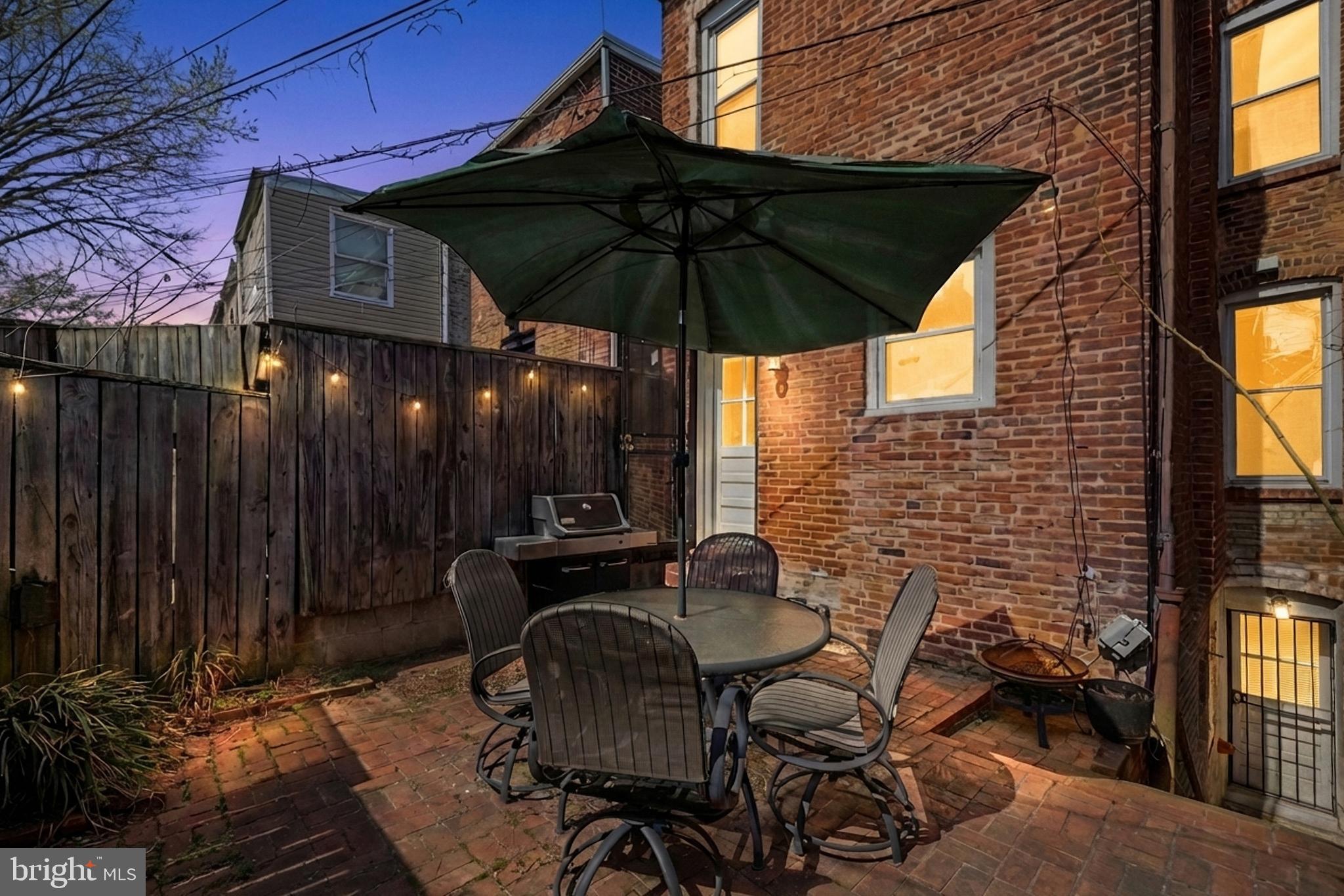 661 F Street Northeast Washington, DC 20002 - Photo 57 of 64 a patio with tables and chairs