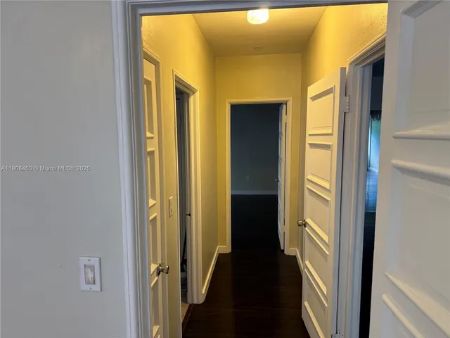 a view of a bathroom from a hallway