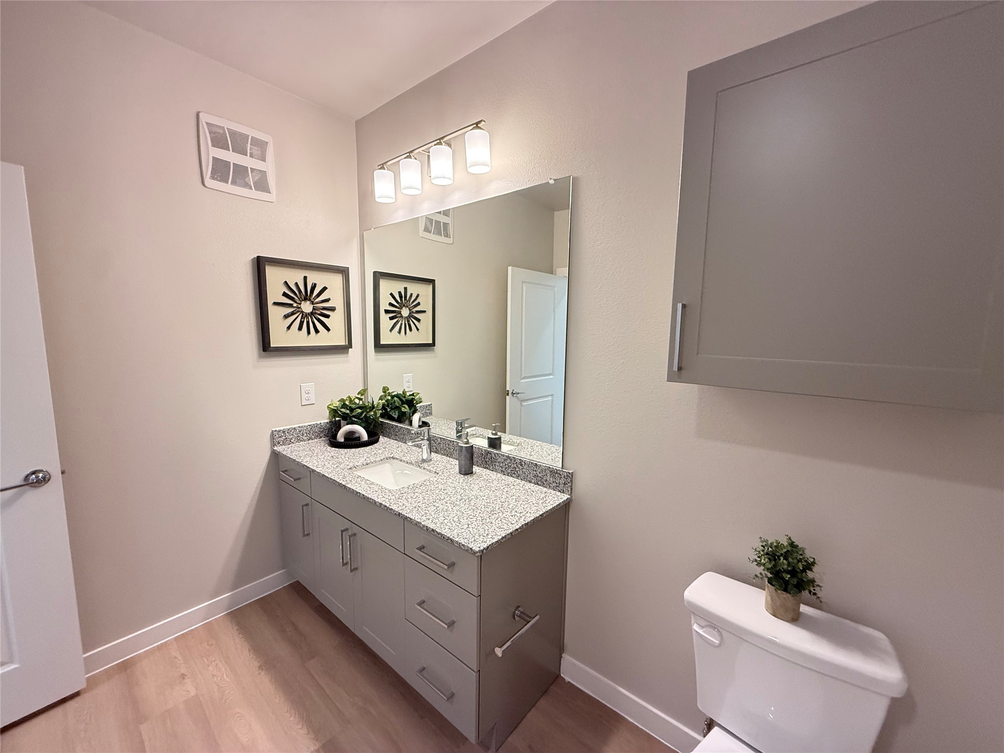 1610 Campbell Road, Unit B1 302 Houston, TX 77055 - Photo 8 of 12 a bathroom with a sink vanity and a mirror