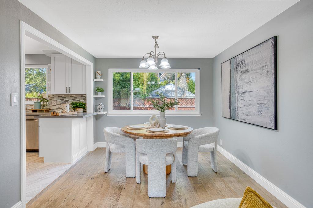 3530 Carlsbad Court Pleasanton, CA 94588 - Photo 28 of 44 a dining room with furniture a large window and wooden floor