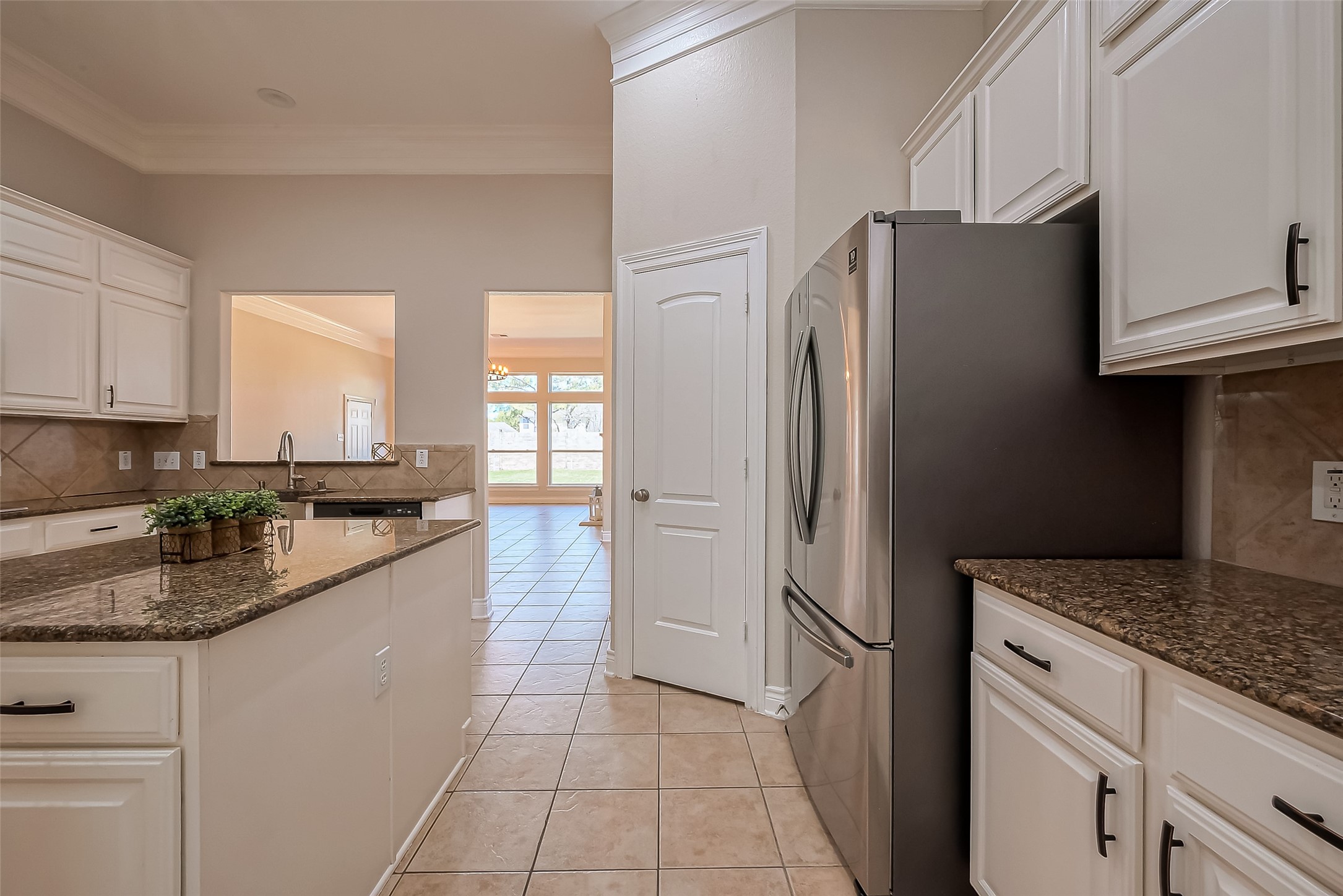 19010 Grove Valley Trail Houston, TX 77084 - Photo 17 of 50 a kitchen with a refrigerator and a sink