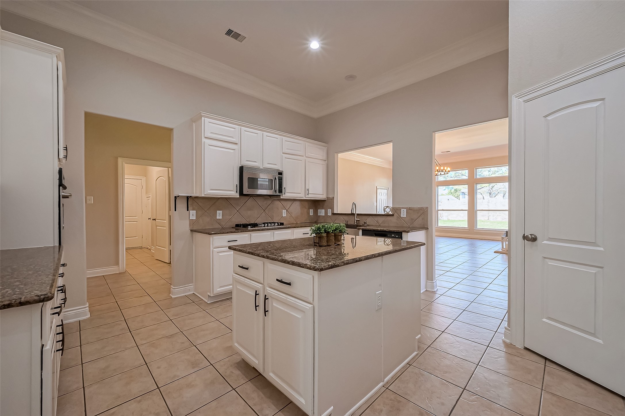 19010 Grove Valley Trail Houston, TX 77084 - Photo 18 of 50 a kitchen with stainless steel appliances granite countertop a sink and cabinets