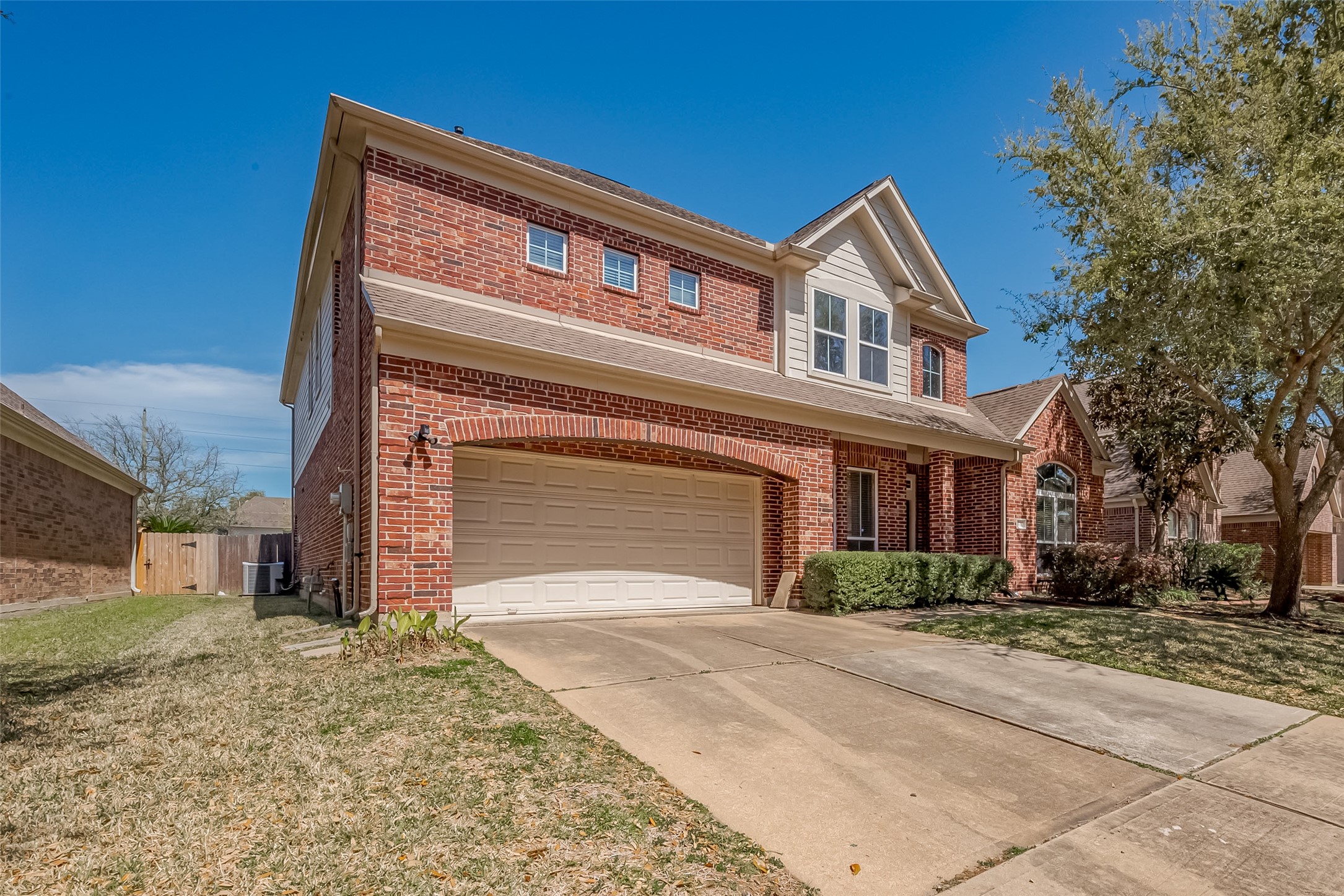 19010 Grove Valley Trail Houston, TX 77084 - Photo 3 of 50 a front view of a house with a yard and garage
