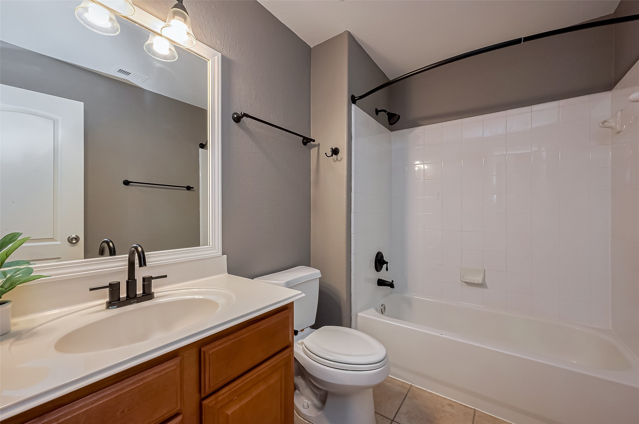19010 Grove Valley Trail Houston, TX 77084 - Photo 34 of 50 a bathroom with a sink toilet tub and shower