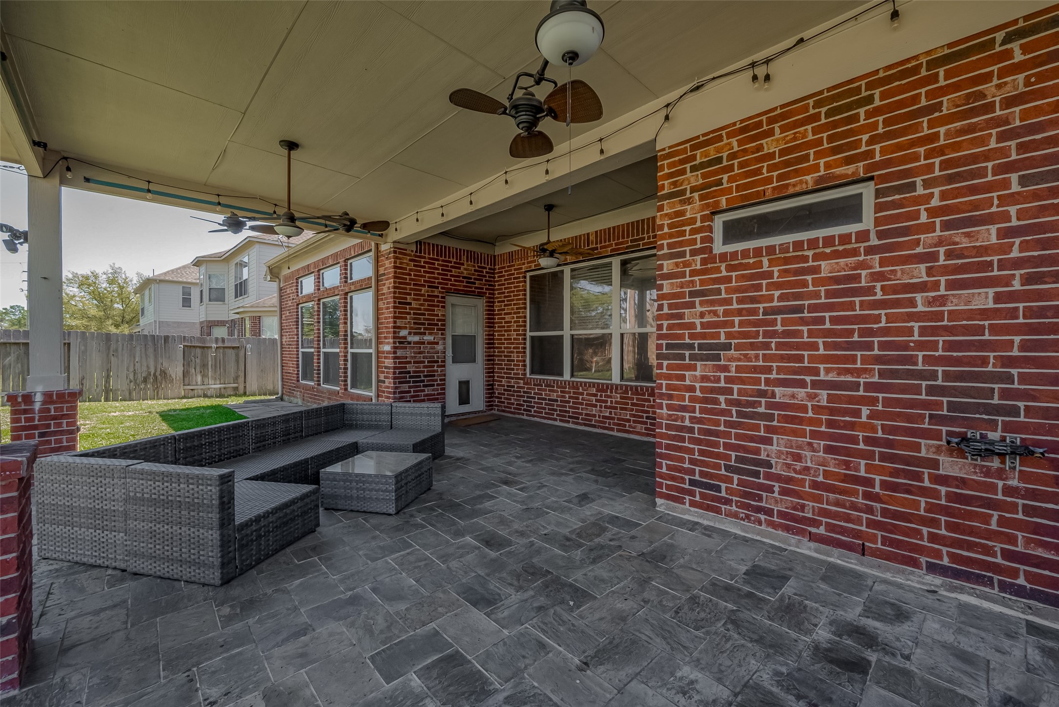 19010 Grove Valley Trail Houston, TX 77084 - Photo 47 of 50 a view of a patio with a table and chairs
