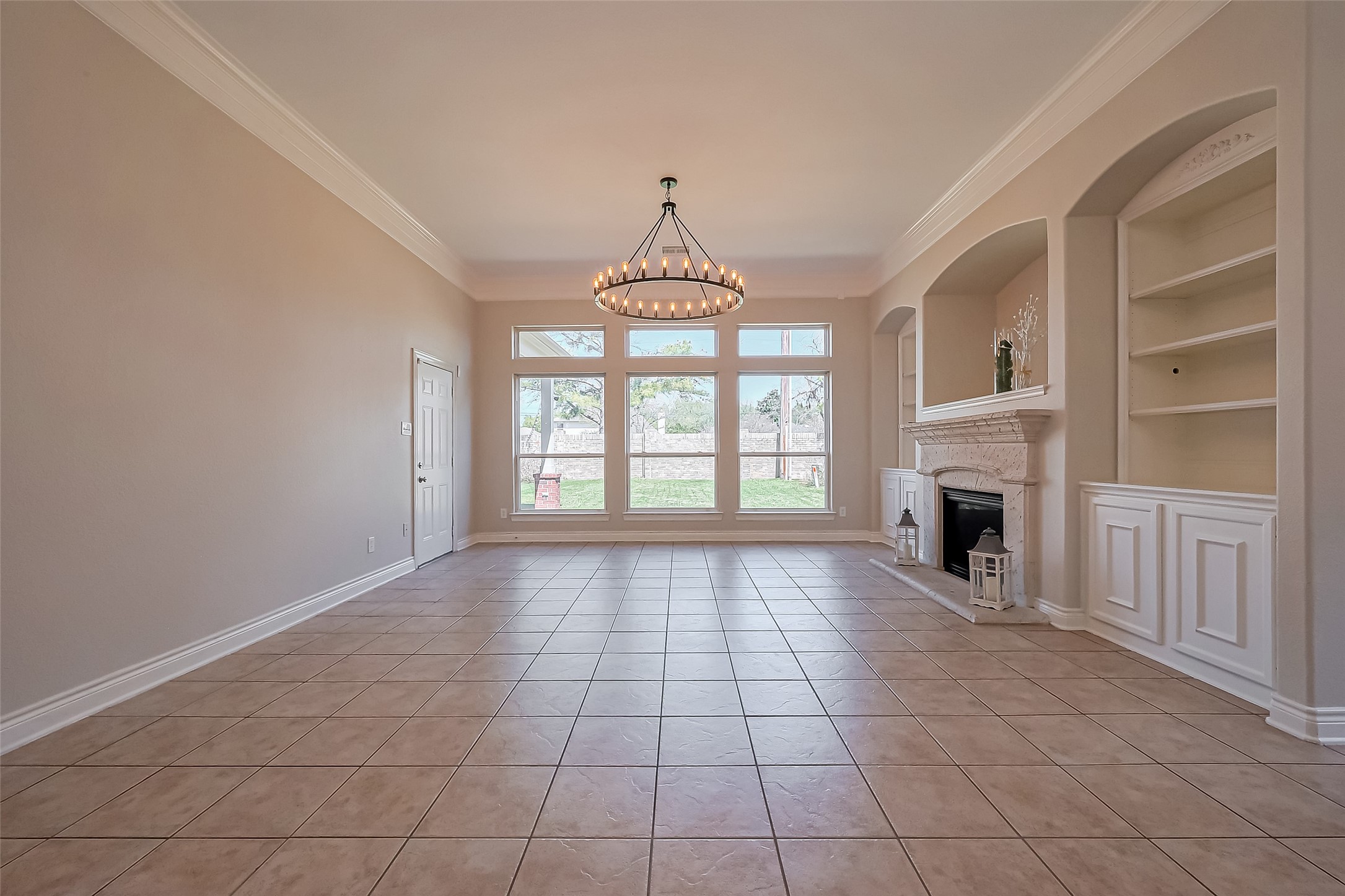 19010 Grove Valley Trail Houston, TX 77084 - Photo 9 of 50 a view of an empty room with a fireplace and a window