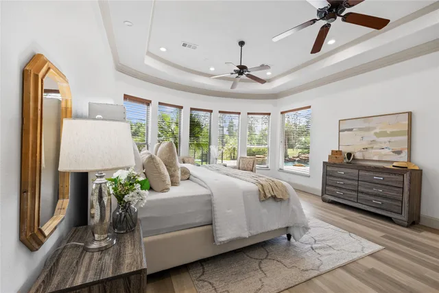 a bedroom with a bed dresser and a window