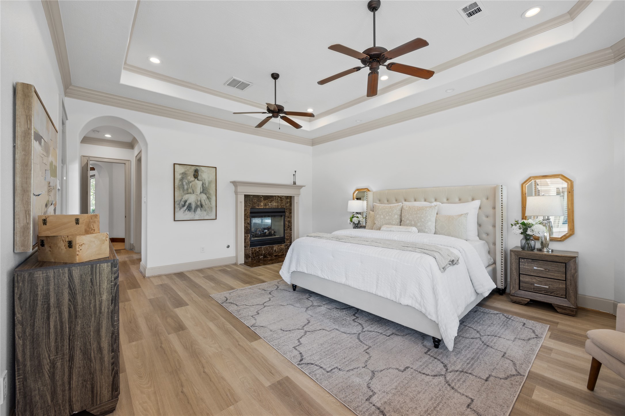 6623 Green Gable Manor Spring, TX 77389 - Photo 15 of 27 a bedroom with a bed ceiling fan and a fireplace