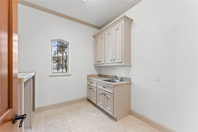 a kitchen with a cabinets and window