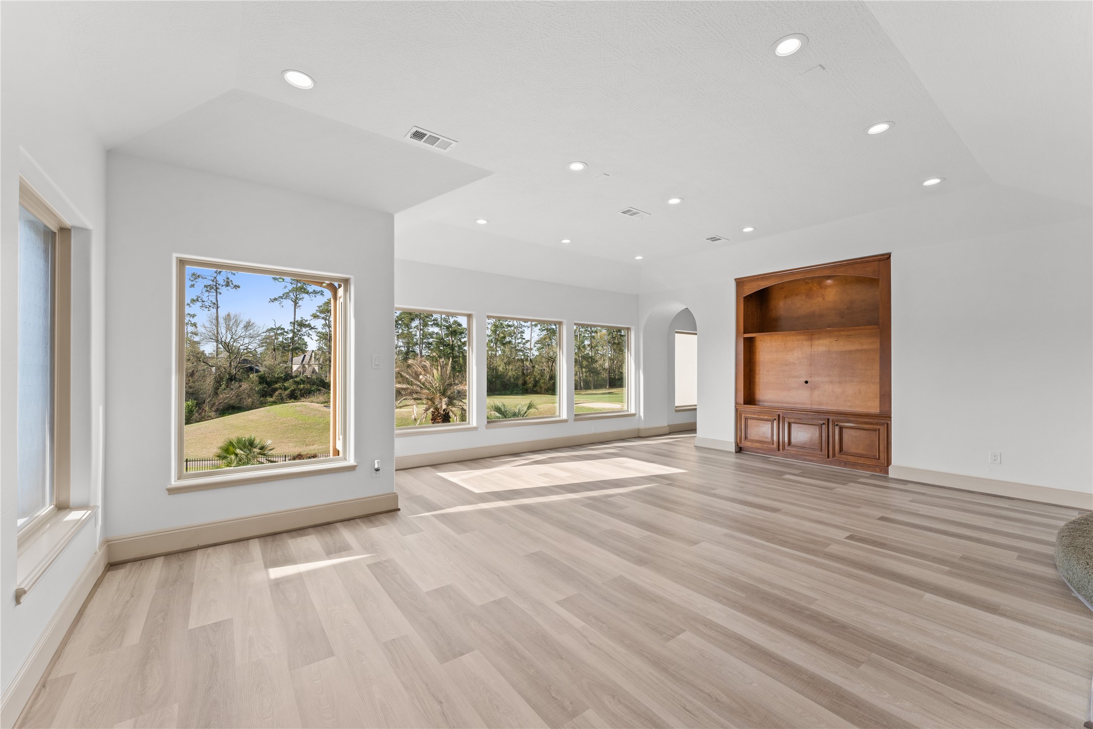 6623 Green Gable Manor Spring, TX 77389 - Photo 19 of 27 a view of an empty room with a window and wooden floor