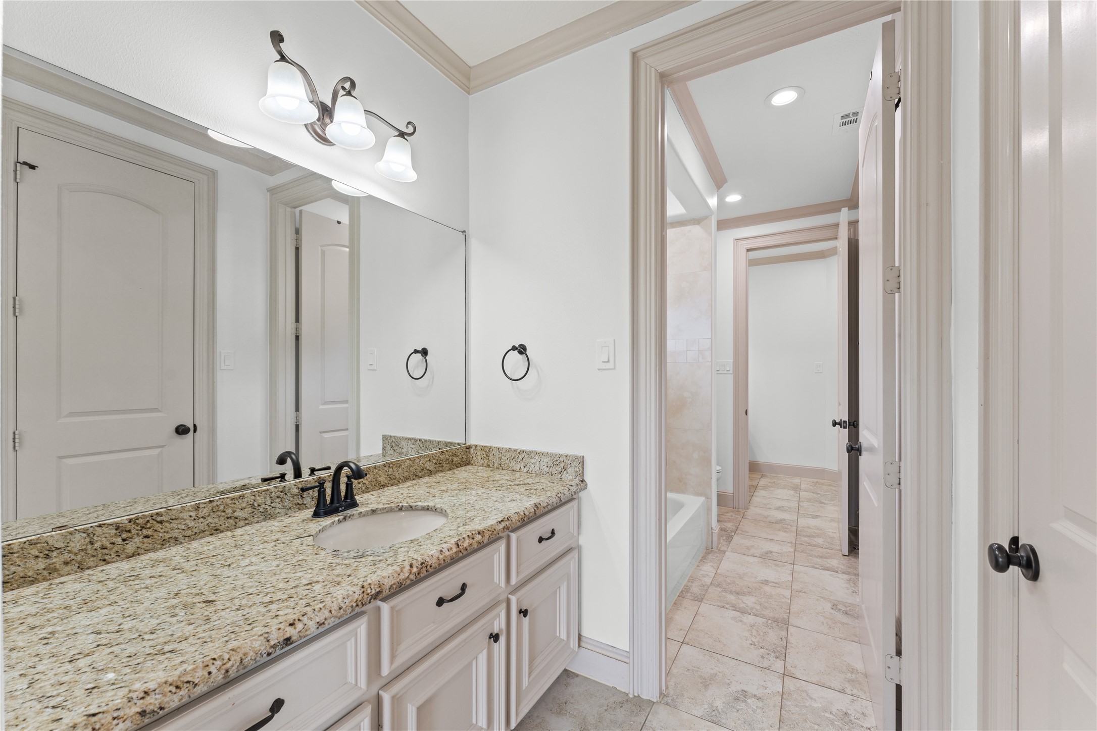 6623 Green Gable Manor Spring, TX 77389 - Photo 21 of 27 a bathroom with a granite countertop sink and a mirror