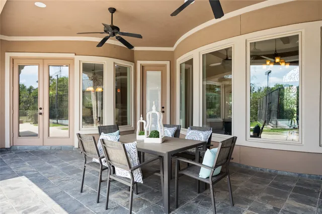 a dining room with furniture window and outdoor view