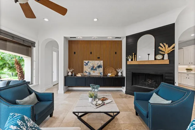 a living room with furniture and a fireplace