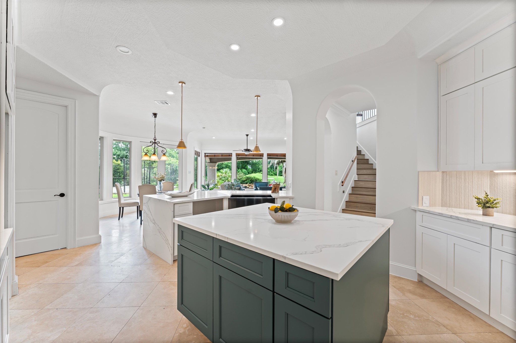 6623 Green Gable Manor Spring, TX 77389 - Photo 3 of 27 a kitchen with a sink a counter and chairs