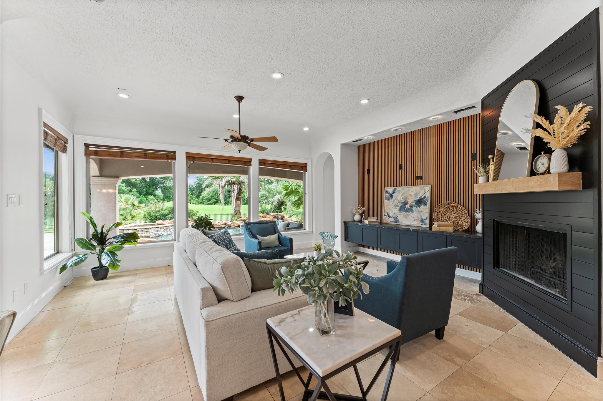 6623 Green Gable Manor Spring, TX 77389 - Photo 7 of 27 a living room with furniture a fireplace and a large window