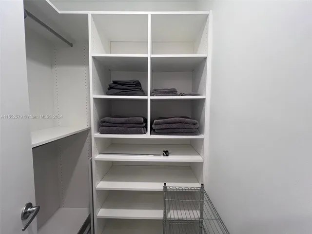 a view of an empty walk in closet