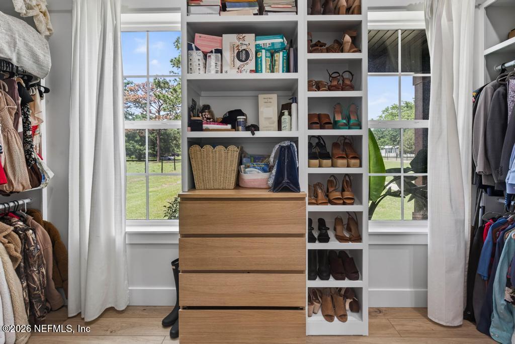 2955 Carroll Corner Road Hilliard, FL 32046 - Photo 63 of 106 a view of walk in closet with clothes and shoes
