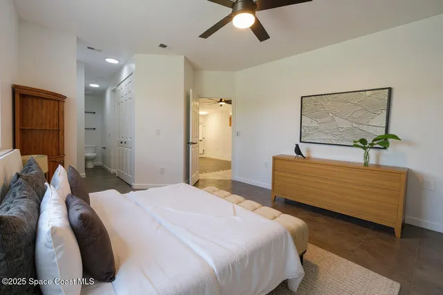 a bedroom with a bed and a dresser