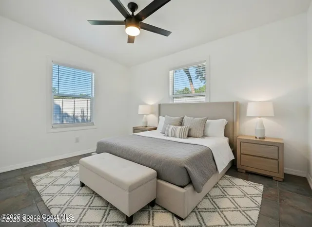 a bedroom with a bed and a couch