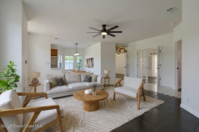 a living room with furniture and a large window