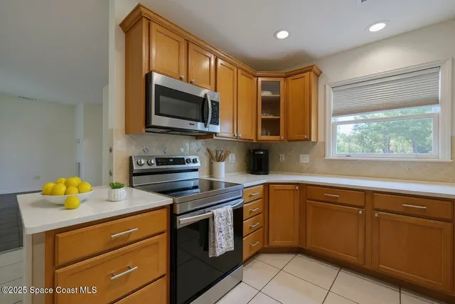 a kitchen with a sink stove and microwave