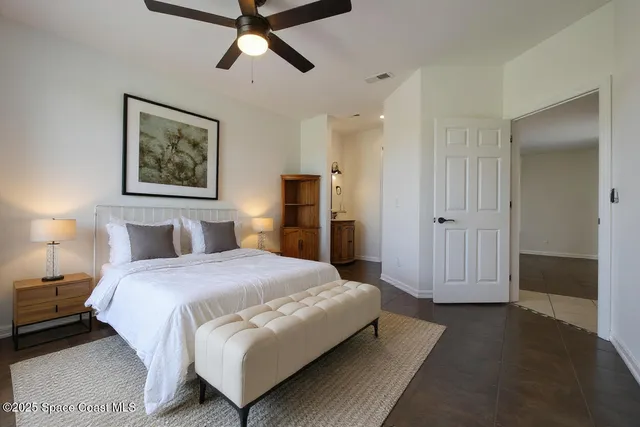 a bedroom with a bed and a walk in closet