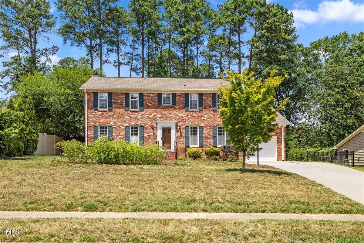 1005 Pebblebrook Drive Raleigh, NC 27609 - Photo 2 of 37 a front view of a house with a yard