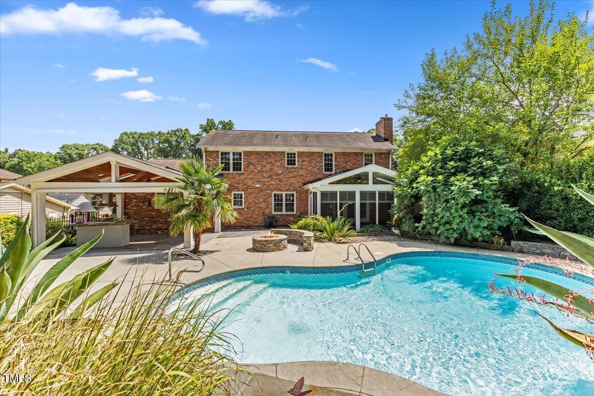 1005 Pebblebrook Drive Raleigh, NC 27609 - Photo 25 of 37 a view of a house with swimming pool and sitting area