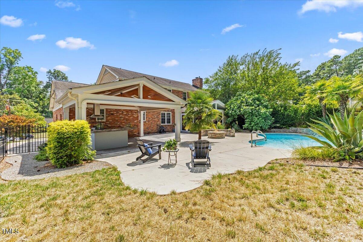 1005 Pebblebrook Drive Raleigh, NC 27609 - Photo 26 of 37 a view of a house with swimming pool and sitting area