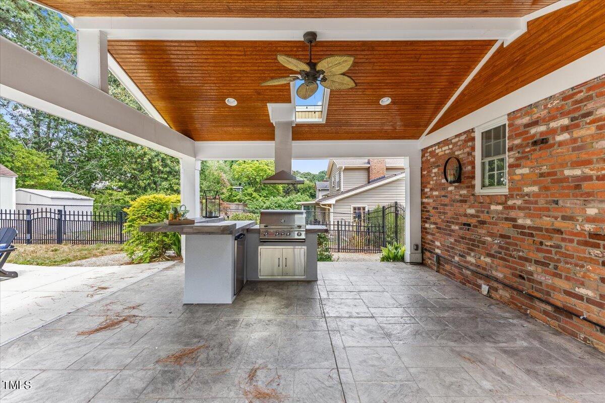 1005 Pebblebrook Drive Raleigh, NC 27609 - Photo 28 of 37 a view of a patio with table and chairs and potted plants