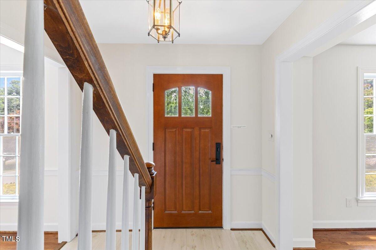 1005 Pebblebrook Drive Raleigh, NC 27609 - Photo 4 of 37 wooden floor with windows and stairs