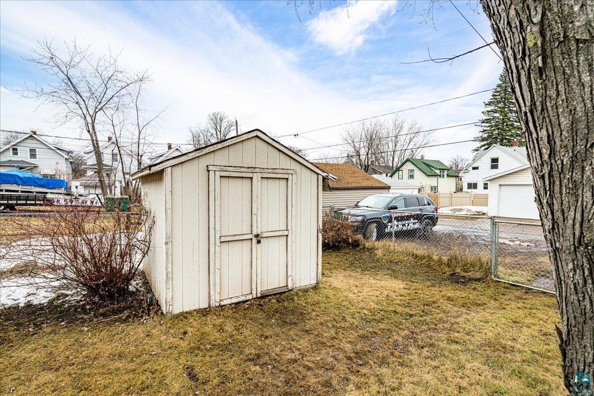 4316 West 6th Street Duluth, MN 55807 - Photo 12 of 38 View of shed featuring a residential view and a gate