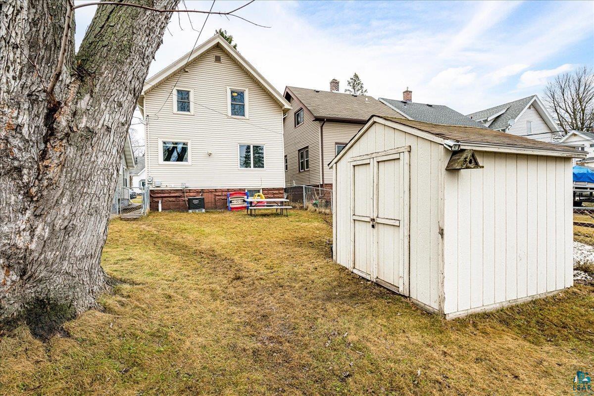 4316 West 6th Street Duluth, MN 55807 - Photo 13 of 38 Back of property featuring a shed and a fenced backyard