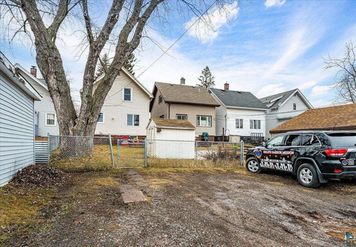4316 West 6th Street Duluth, MN 55807 - Photo 15 of 38 View of front of home featuring a gate, a residential view, and an outbuilding
