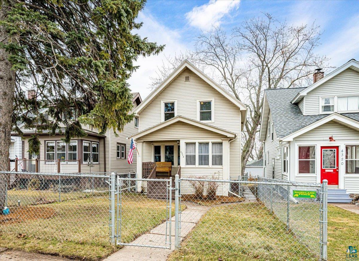4316 West 6th Street Duluth, MN 55807 - Photo 8 of 38 View of front of property featuring a gate, a fenced front yard, and roof with shingles
