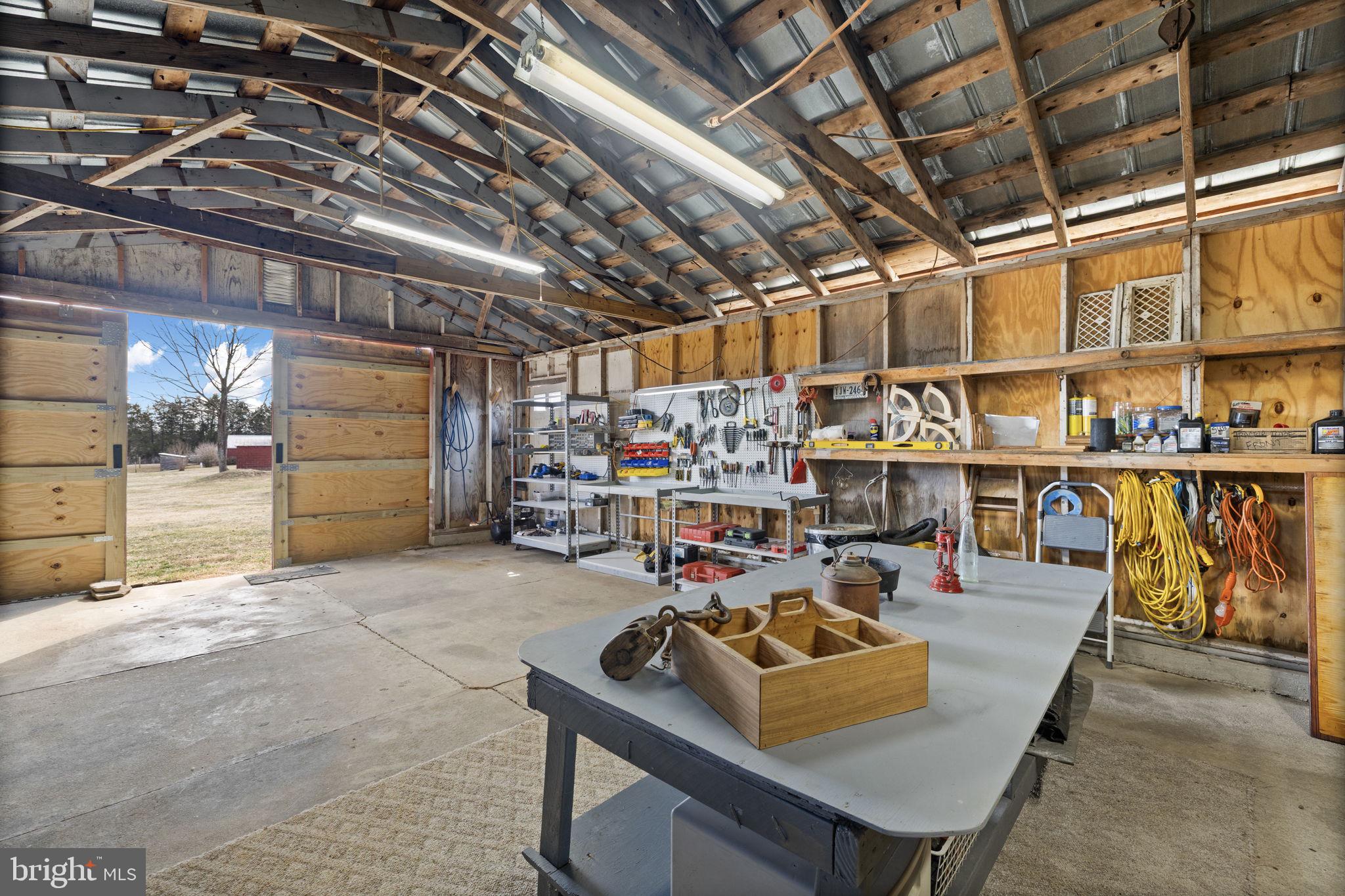 1815 Country Road Beaverdam, VA 23015 - Photo 72 of 92 Organized shop with work tables