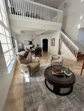 a living room with furniture and a table