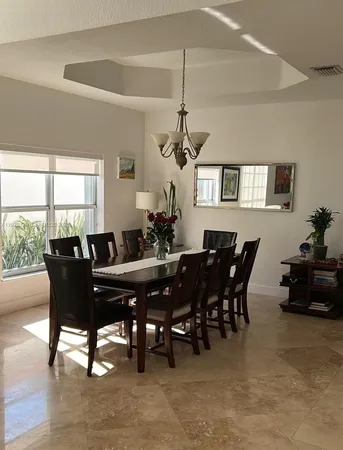 a view of a dining room with furniture