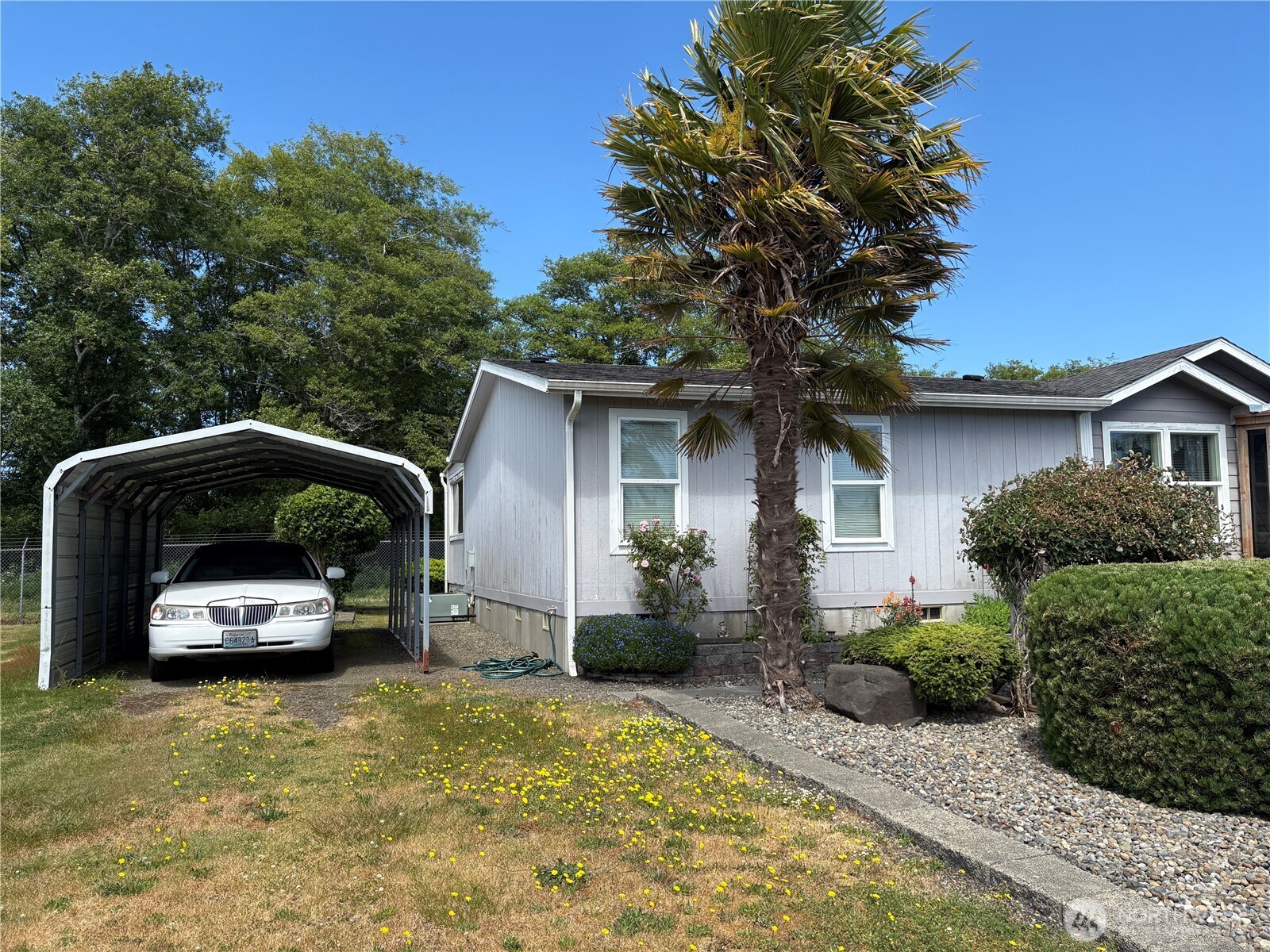 51 Meander Way Aberdeen, WA 98520 - Photo 17 of 22 a front view of house with yard outdoor seating and barbeque oven