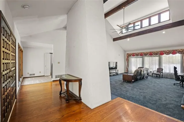 a view of a livingroom with furniture and a window