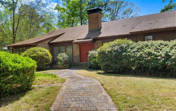 a view of a backyard with potted plants