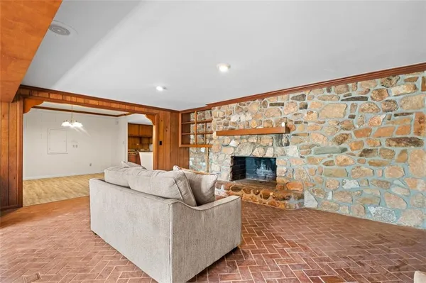 a living room with a couch and a fireplace