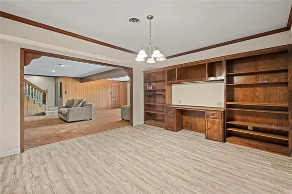 a bedroom with furniture and window