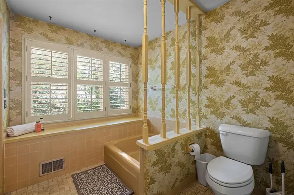 a bathroom with a toilet a sink and a bathtub