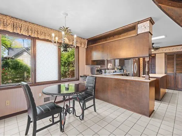 a view of a dining room with furniture window and outside view
