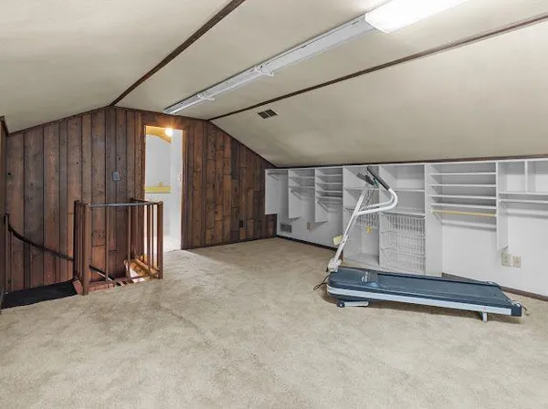 an empty room with staircase