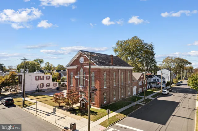 a view of a street with cars on the road
