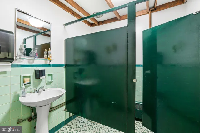 a kitchen with a refrigerator and a stove