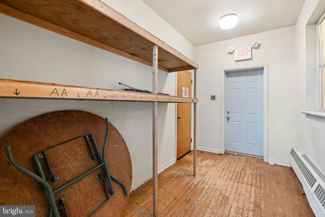a reading room with furniture and a book shelf