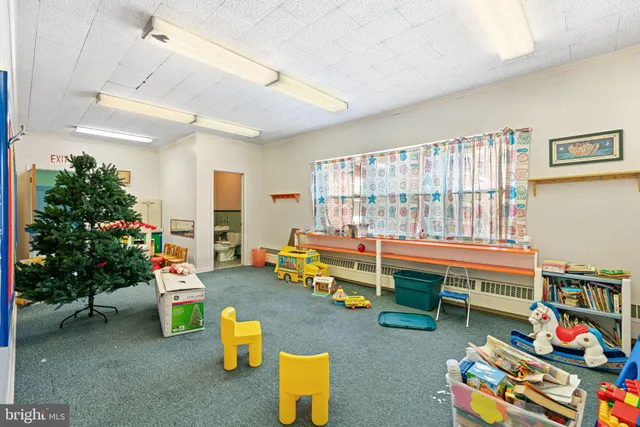 a bathroom with a sink mirror and toilet